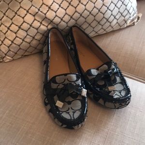 A brand new pair of coach slide on loafers